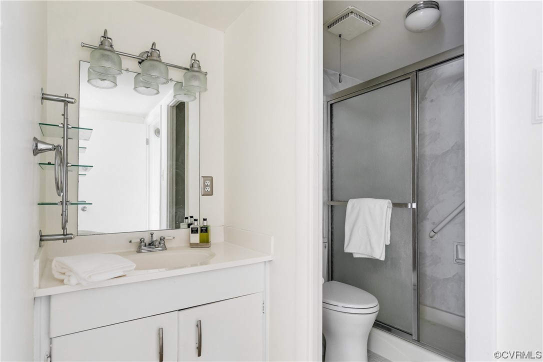 1509 Regency Woods Road, Unit 103 Henrico, VA 23238 - Photo 21 of 31 a bathroom with a sink toilet and shower