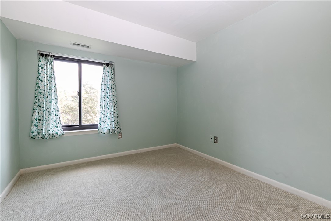1509 Regency Woods Road, Unit 103 Henrico, VA 23238 - Photo 23 of 31 an empty room with a window