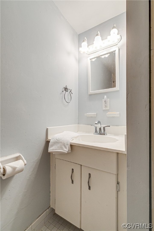 1509 Regency Woods Road, Unit 103 Henrico, VA 23238 - Photo 27 of 31 a bathroom with a granite countertop sink and a mirror