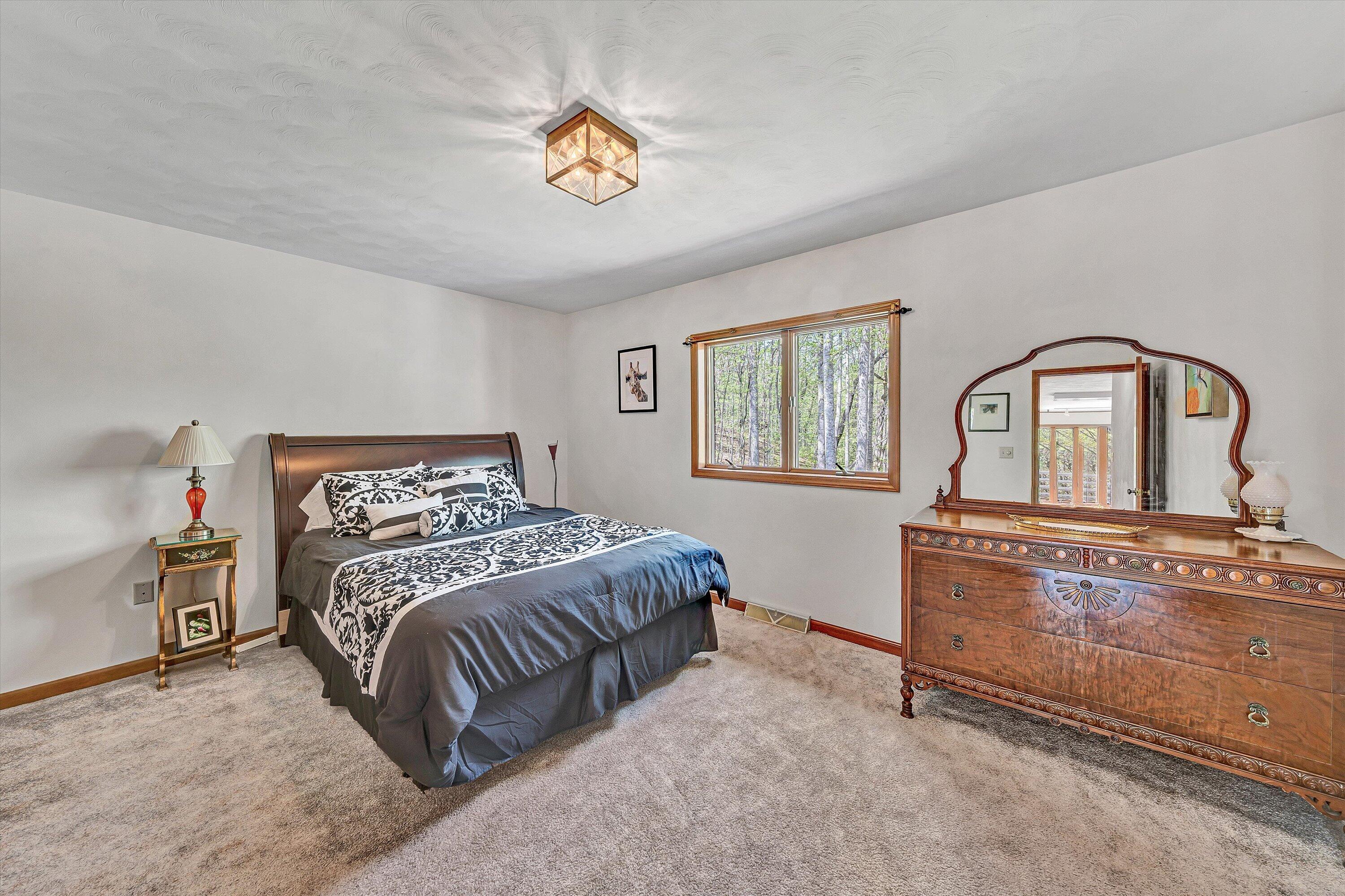 1124 Old Hollow Road Buchanan, VA 24066 - Photo 25 of 73 a bedroom with a bed and dresser