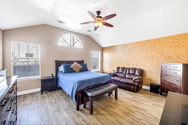 a bed room with a bed and a window