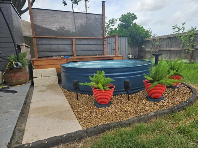 a outdoor dining space with a potted plant