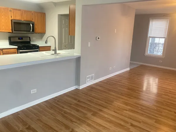 a view of a kitchen from the hallway
