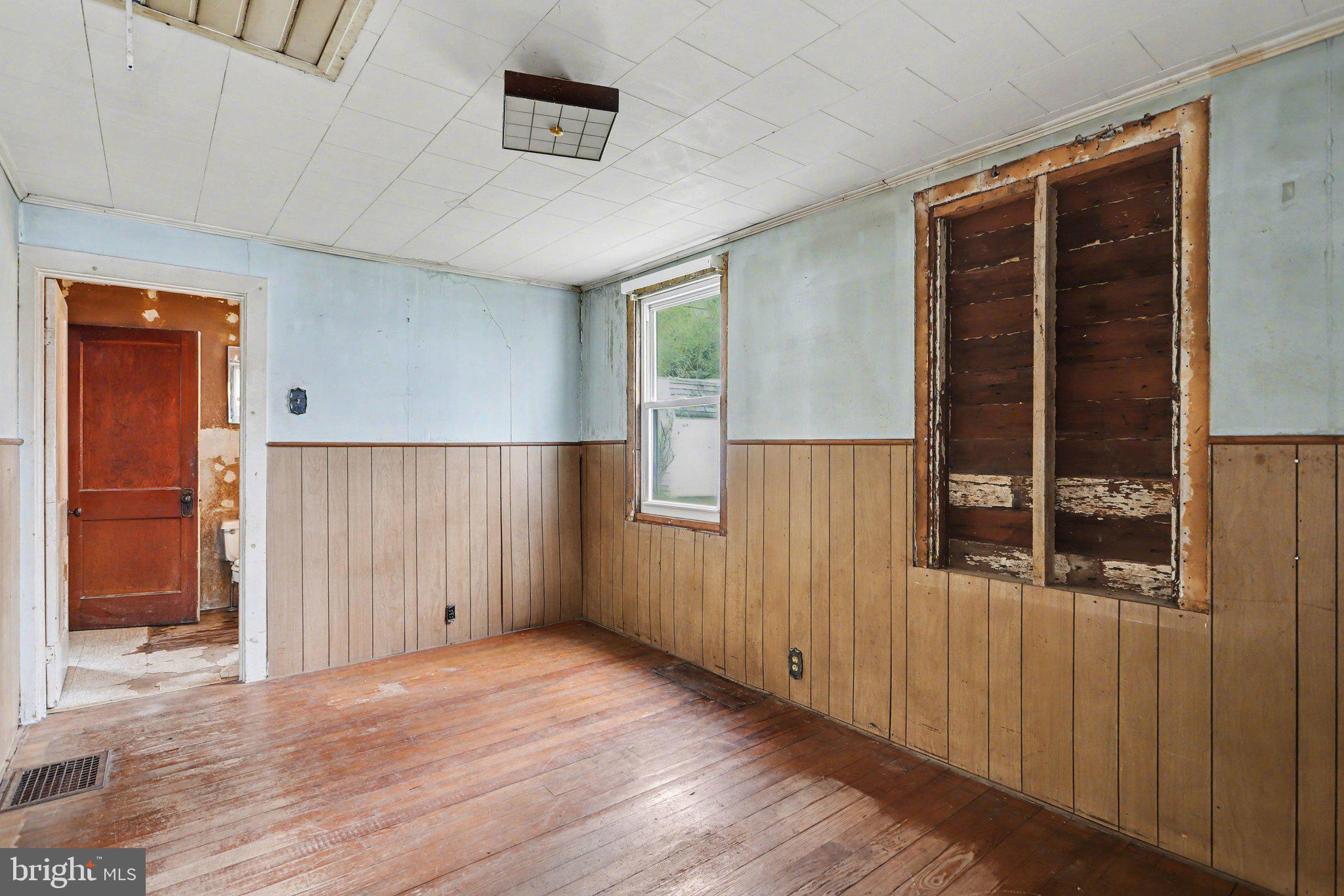924 River Road Marysville, PA 17053 - Photo 11 of 32 an empty room with wooden floor and a window