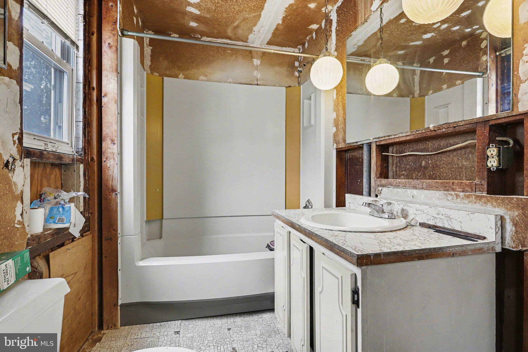 924 River Road Marysville, PA 17053 - Photo 12 of 32 a bathroom with a sink a vanity a mirror and a bathtub