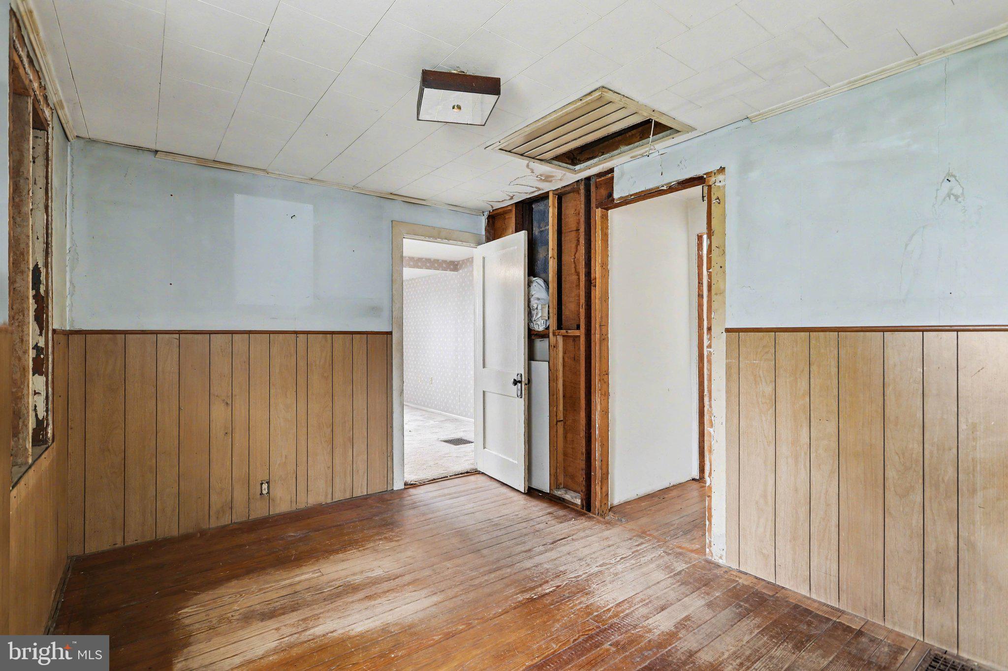 924 River Road Marysville, PA 17053 - Photo 13 of 32 an empty room with wooden floor and windows