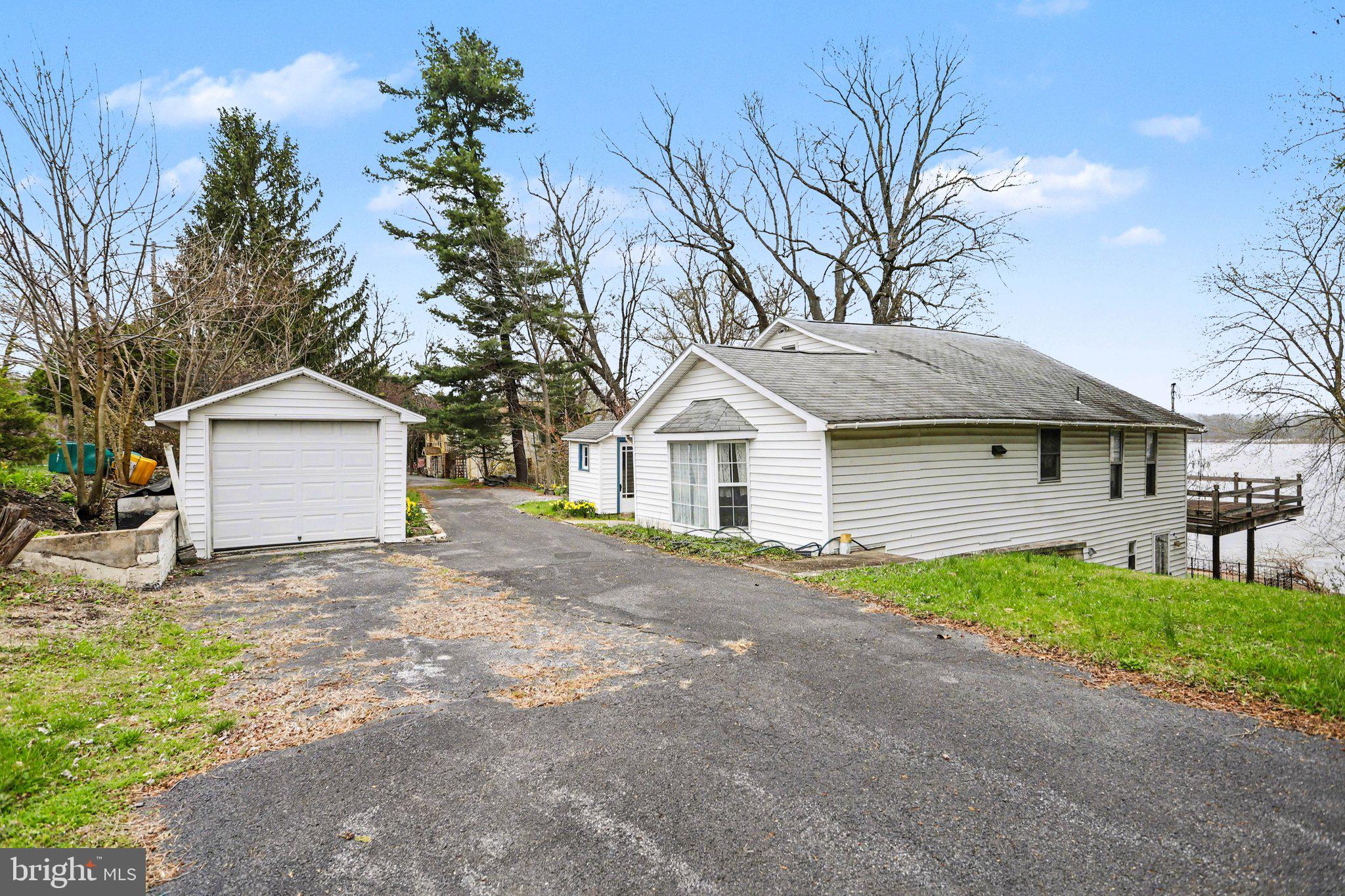 924 River Road Marysville, PA 17053 - Photo 29 of 32 a front view of a house with a yard and garage