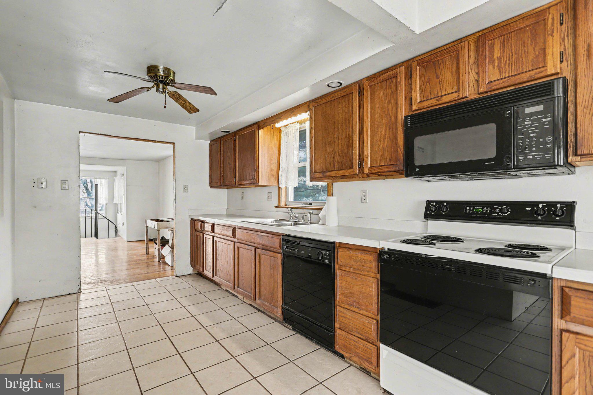 924 River Road Marysville, PA 17053 - Photo 6 of 32 a kitchen with stainless steel appliances a stove sink microwave and cabinets