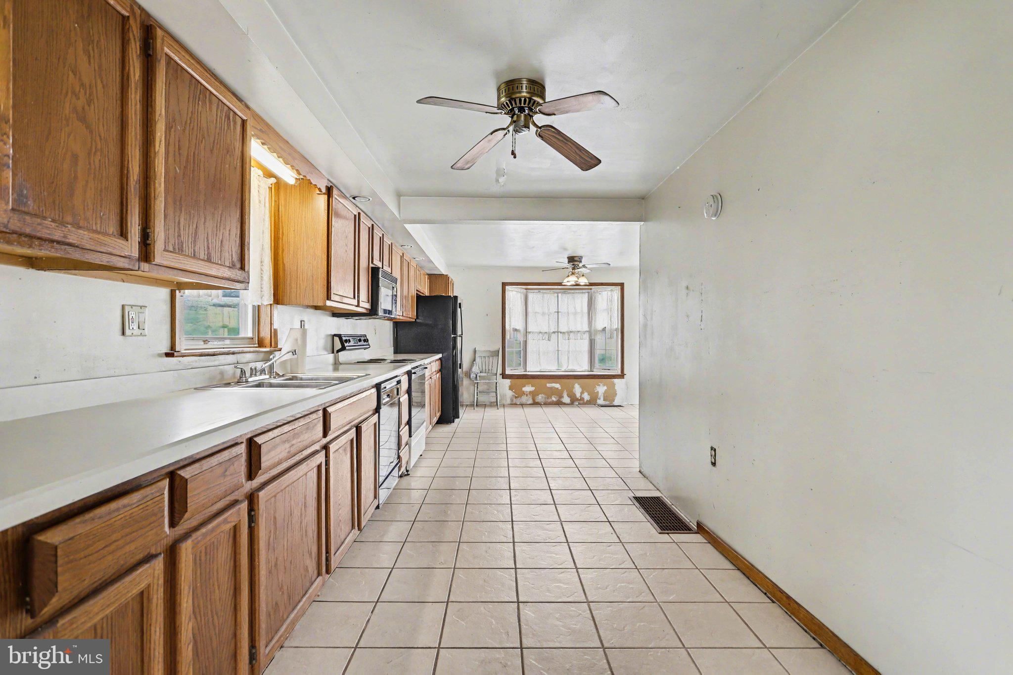 924 River Road Marysville, PA 17053 - Photo 7 of 32 a view of a kitchen with a sink and windows