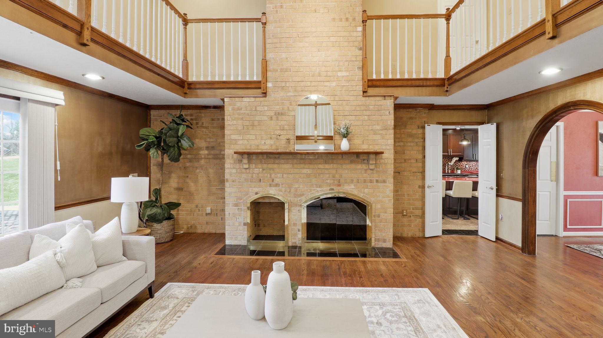12302 Prospect Landing Bowie, MD 20721 - Photo 14 of 104 a living room with furniture and a fireplace