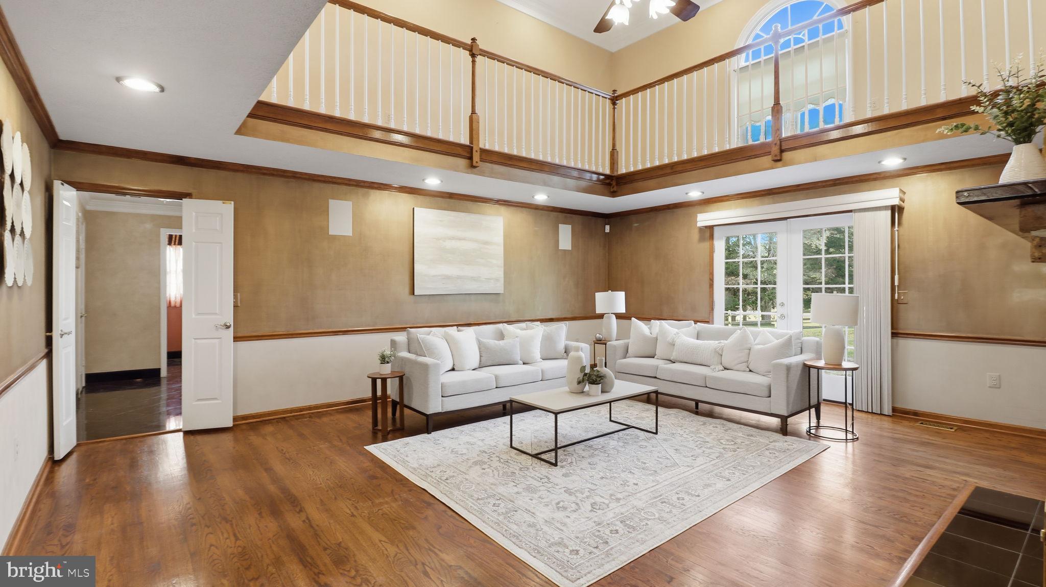 12302 Prospect Landing Bowie, MD 20721 - Photo 18 of 104 a living room with furniture and a ceiling fan