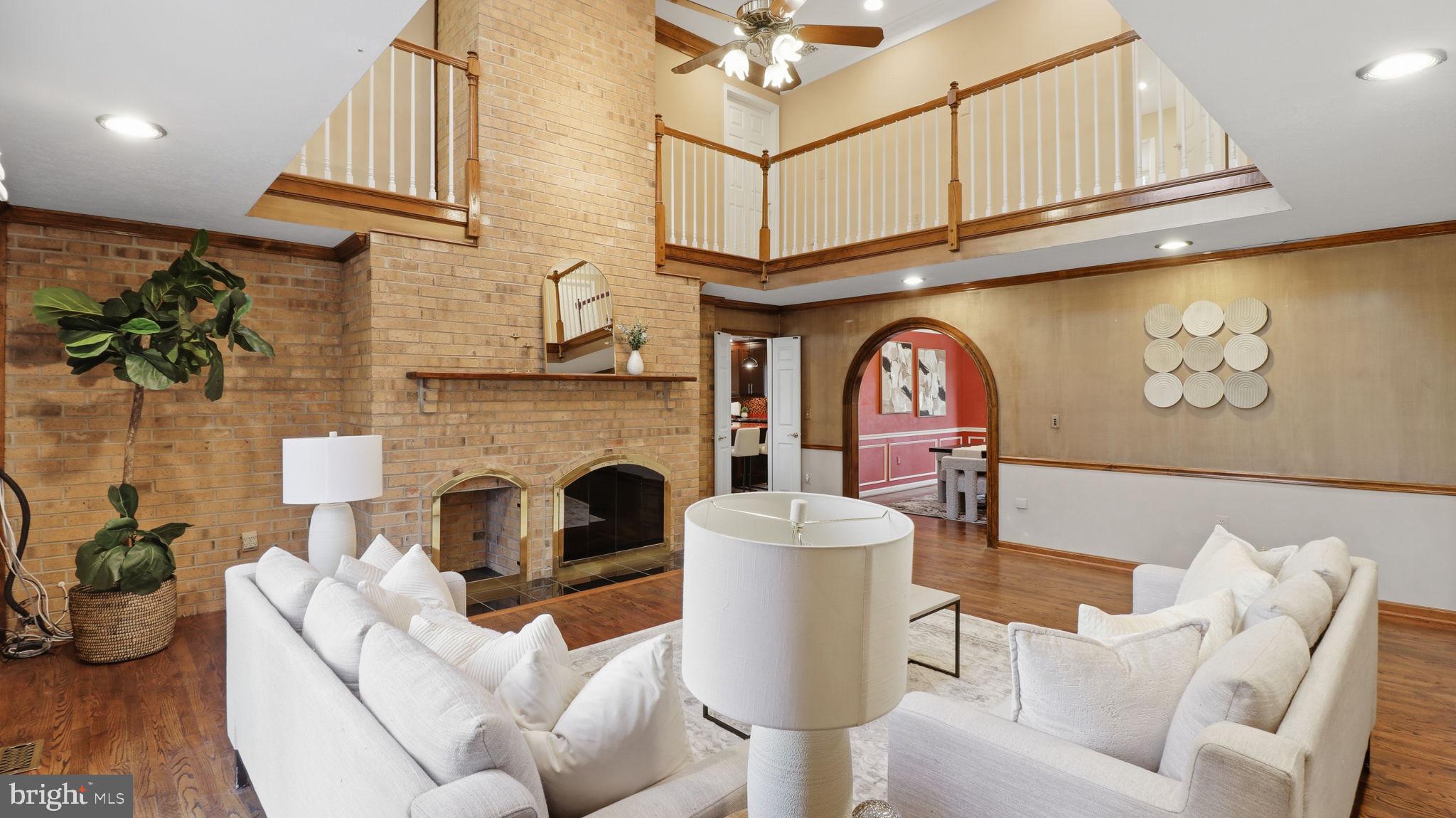 12302 Prospect Landing Bowie, MD 20721 - Photo 19 of 104 a living room with furniture a fireplace and a flat screen tv