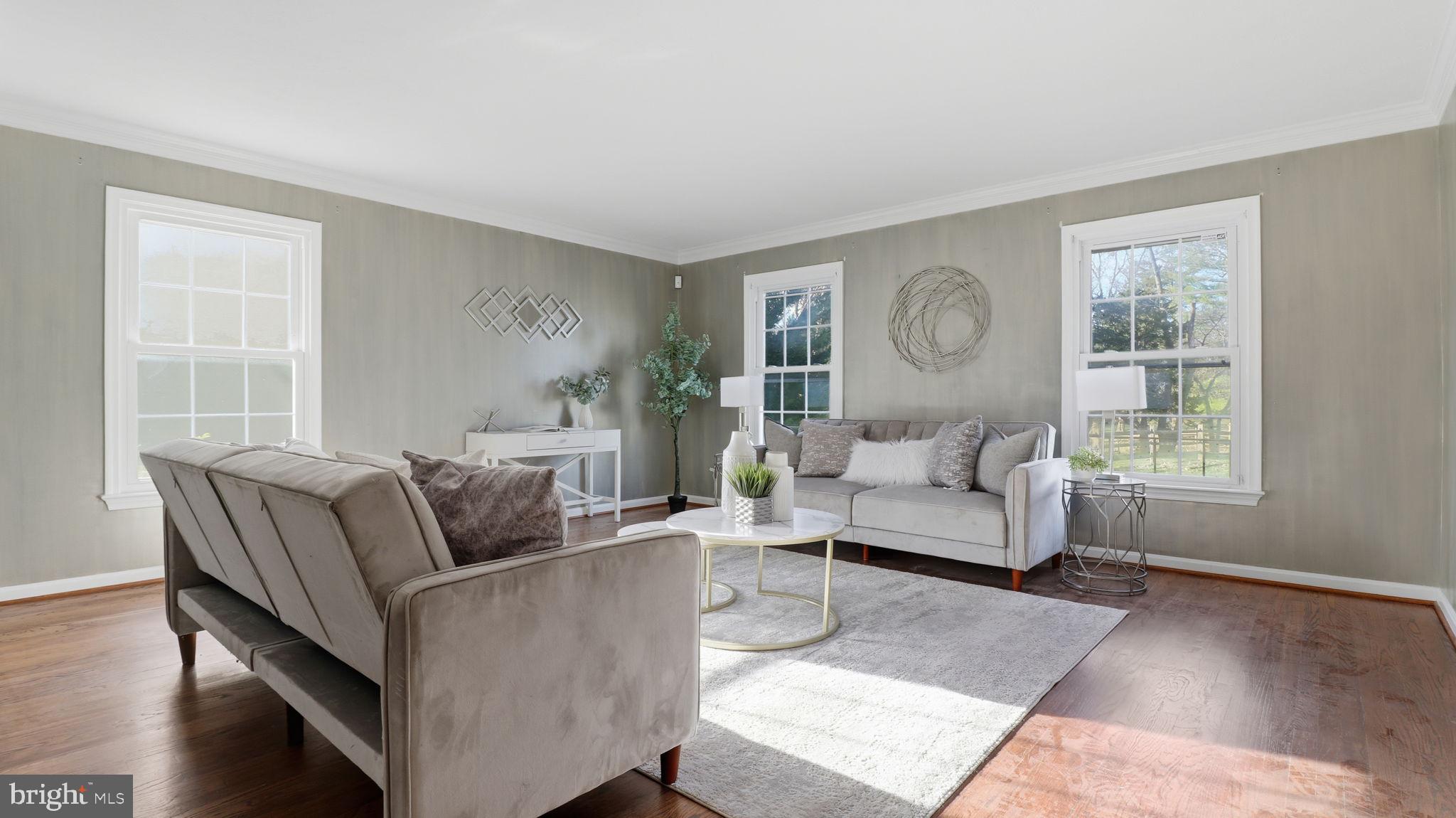 12302 Prospect Landing Bowie, MD 20721 - Photo 22 of 104 a living room with furniture and a large window