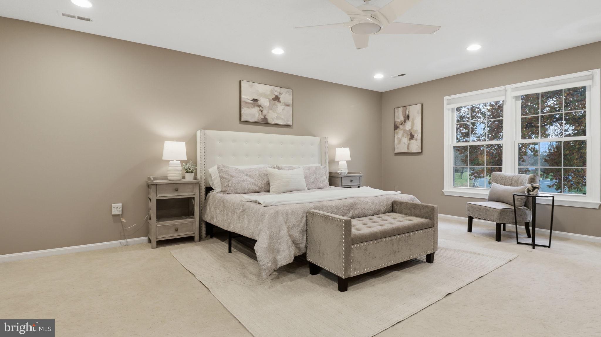 12302 Prospect Landing Bowie, MD 20721 - Photo 40 of 104 a spacious bedroom with a bed and a large window