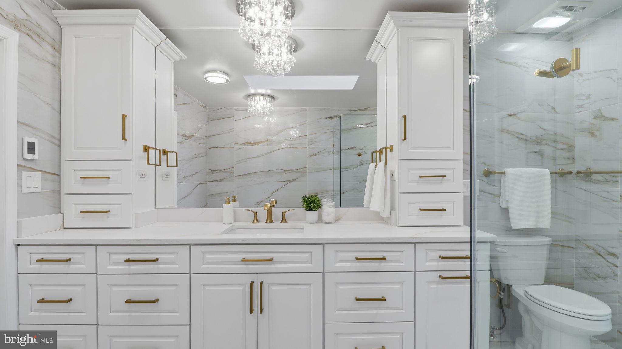 12302 Prospect Landing Bowie, MD 20721 - Photo 46 of 104 a bathroom with a sink a toilet and shower