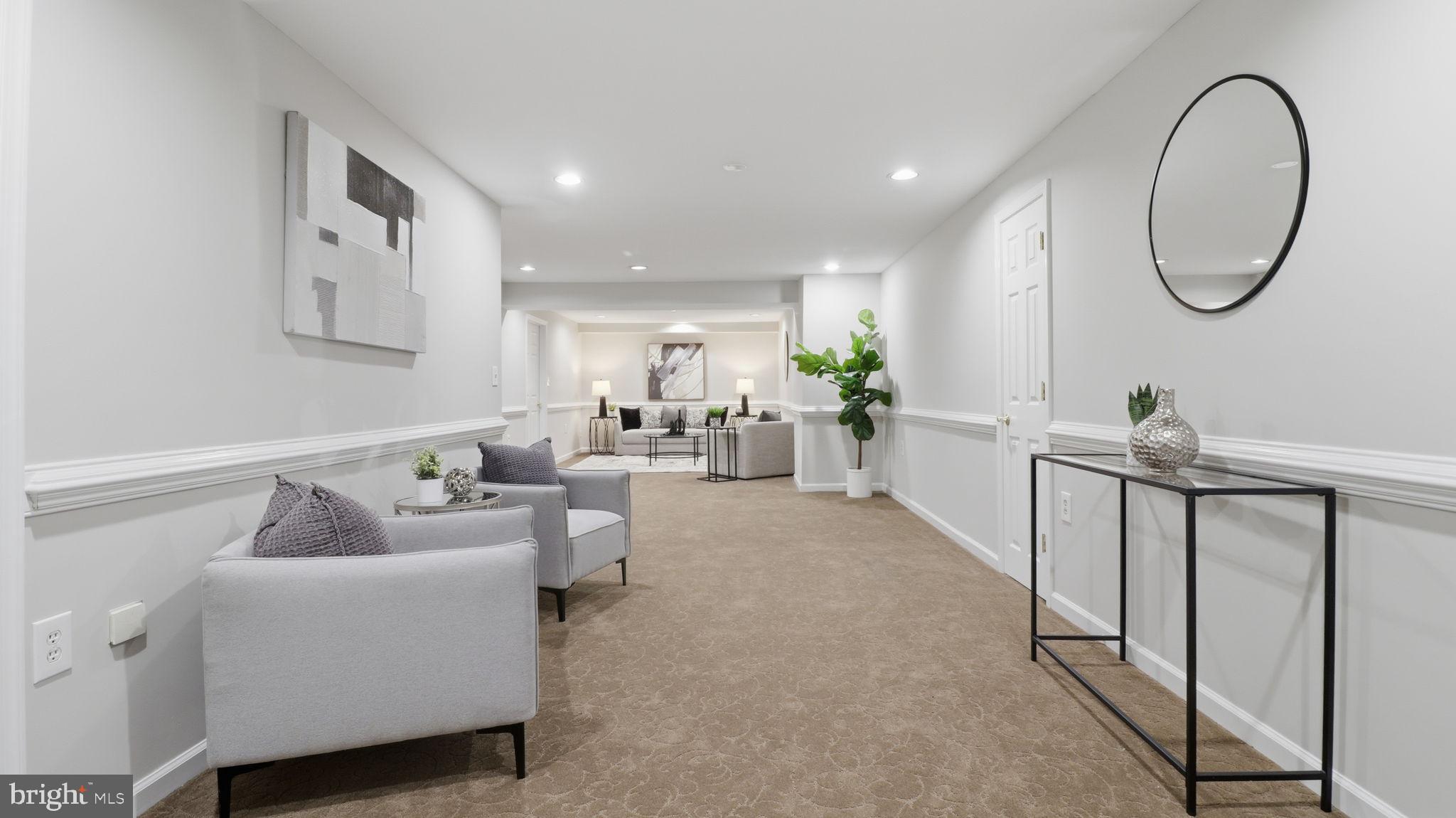 12302 Prospect Landing Bowie, MD 20721 - Photo 68 of 104 a living room with furniture a mirror and a window