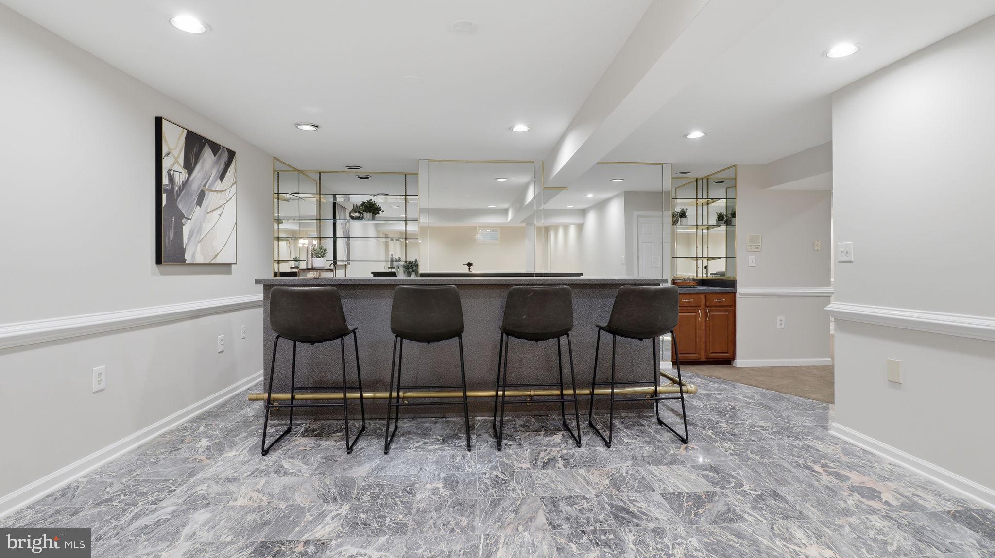 12302 Prospect Landing Bowie, MD 20721 - Photo 70 of 104 Wet bar with shelving and wine fridge.