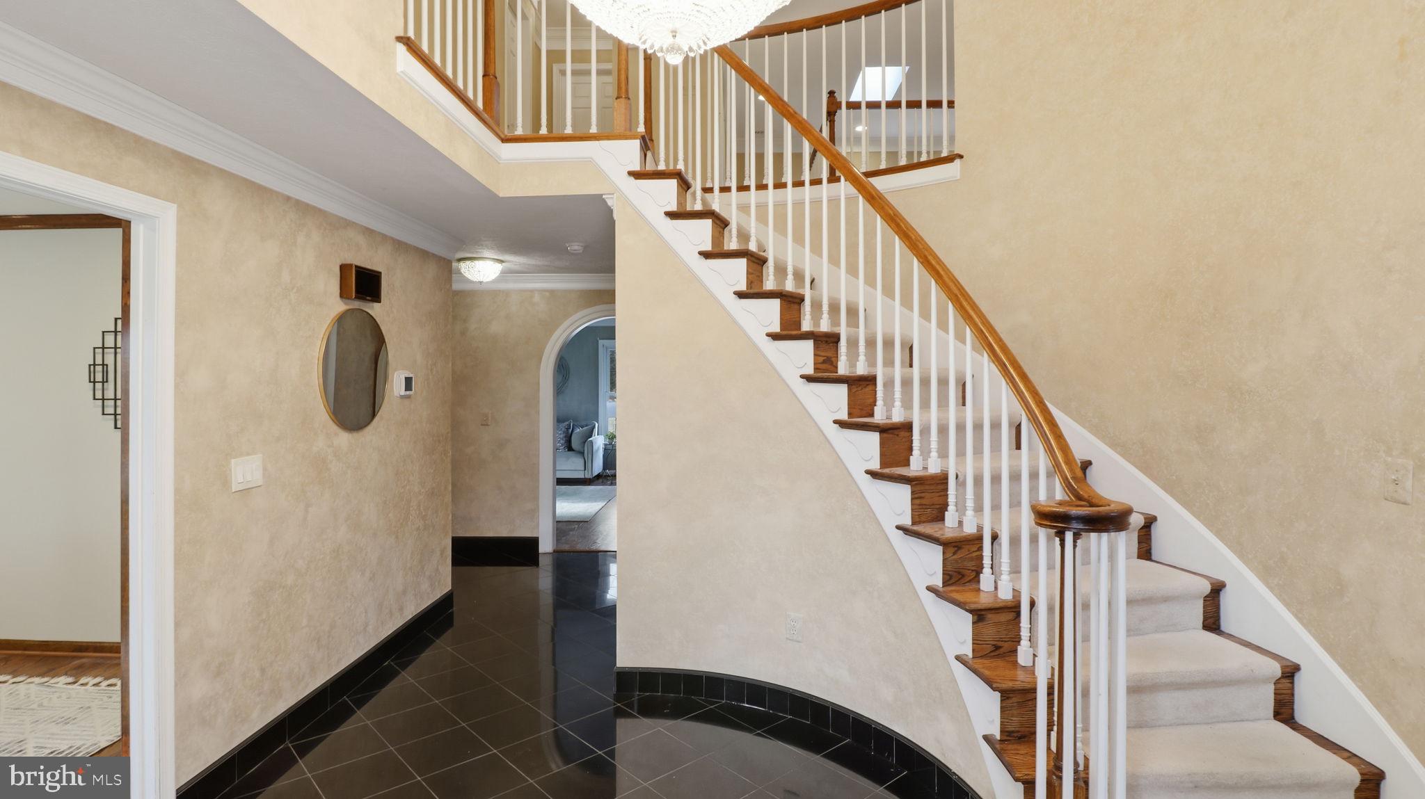 12302 Prospect Landing Bowie, MD 20721 - Photo 7 of 104 a view of entryway and hall with wooden floor