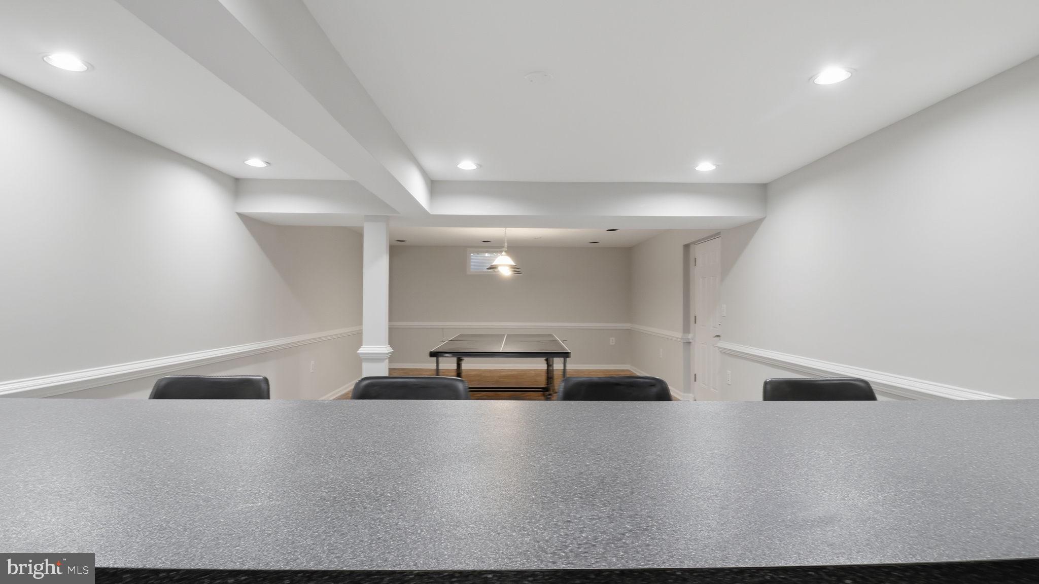12302 Prospect Landing Bowie, MD 20721 - Photo 72 of 104 a view of an empty room with wooden floor