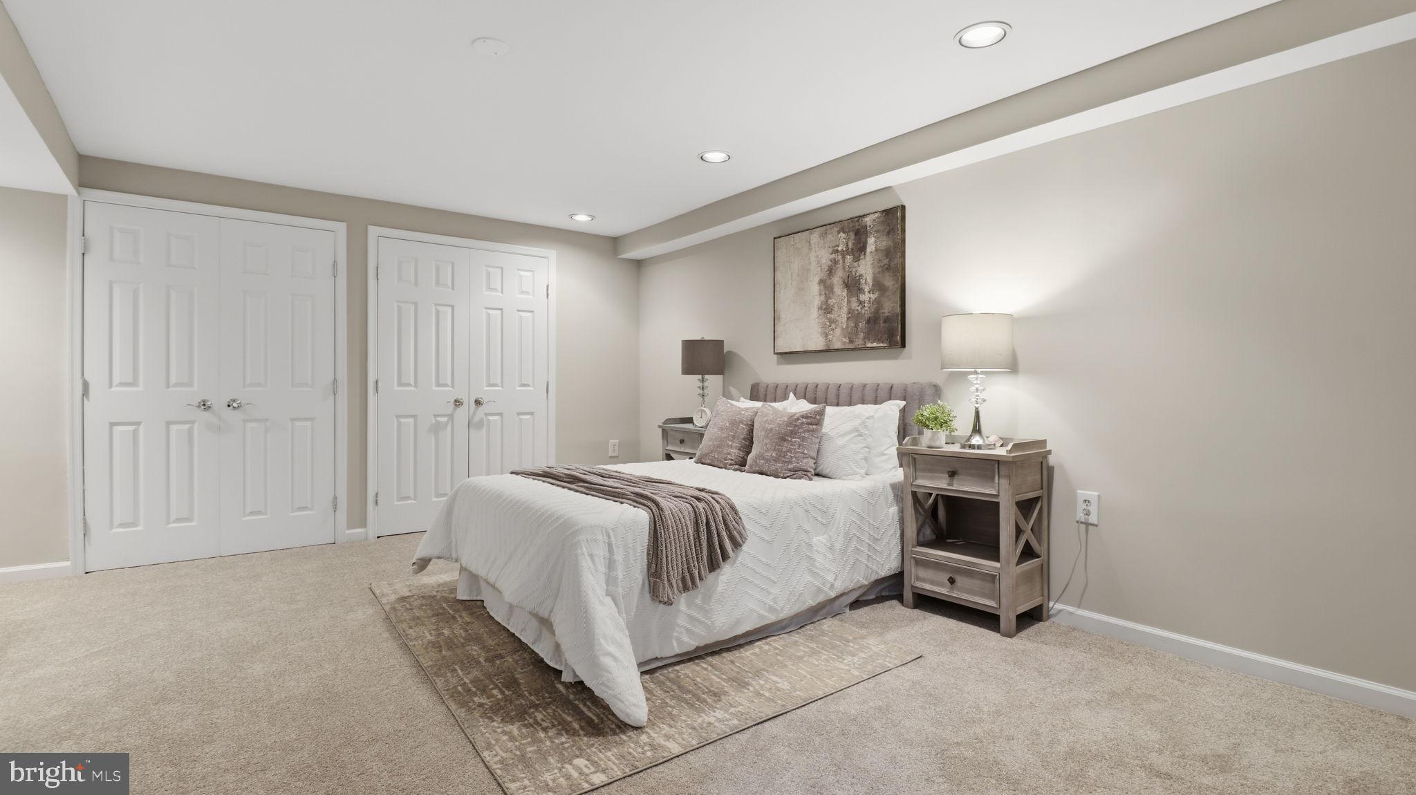 12302 Prospect Landing Bowie, MD 20721 - Photo 80 of 104 a spacious bedroom with a bed and cabinet