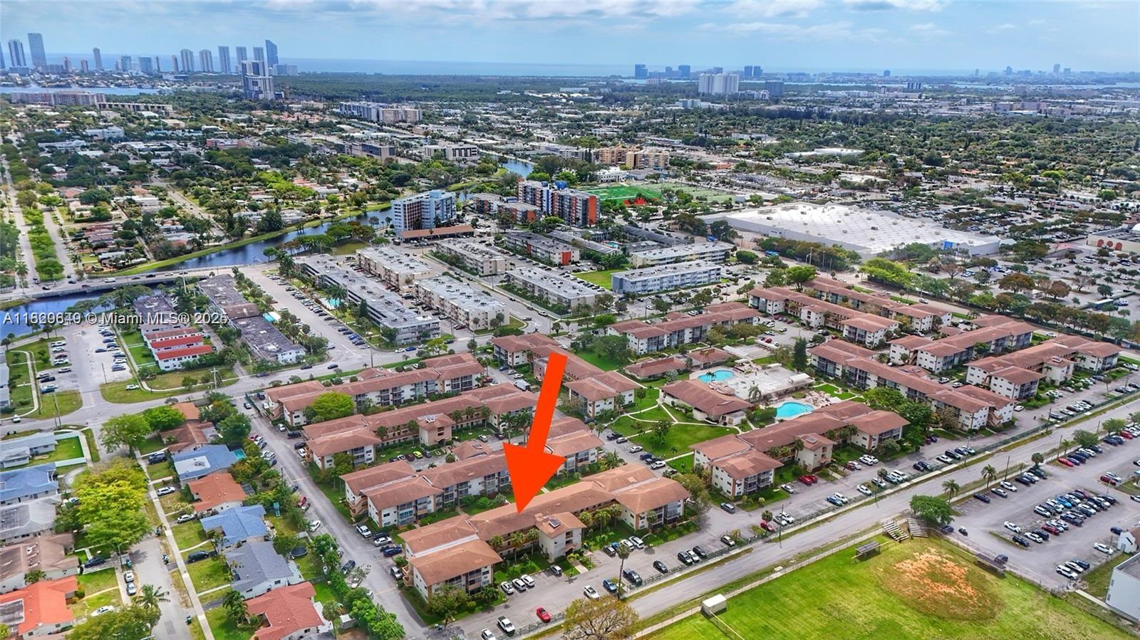an aerial view of residential houses with city view