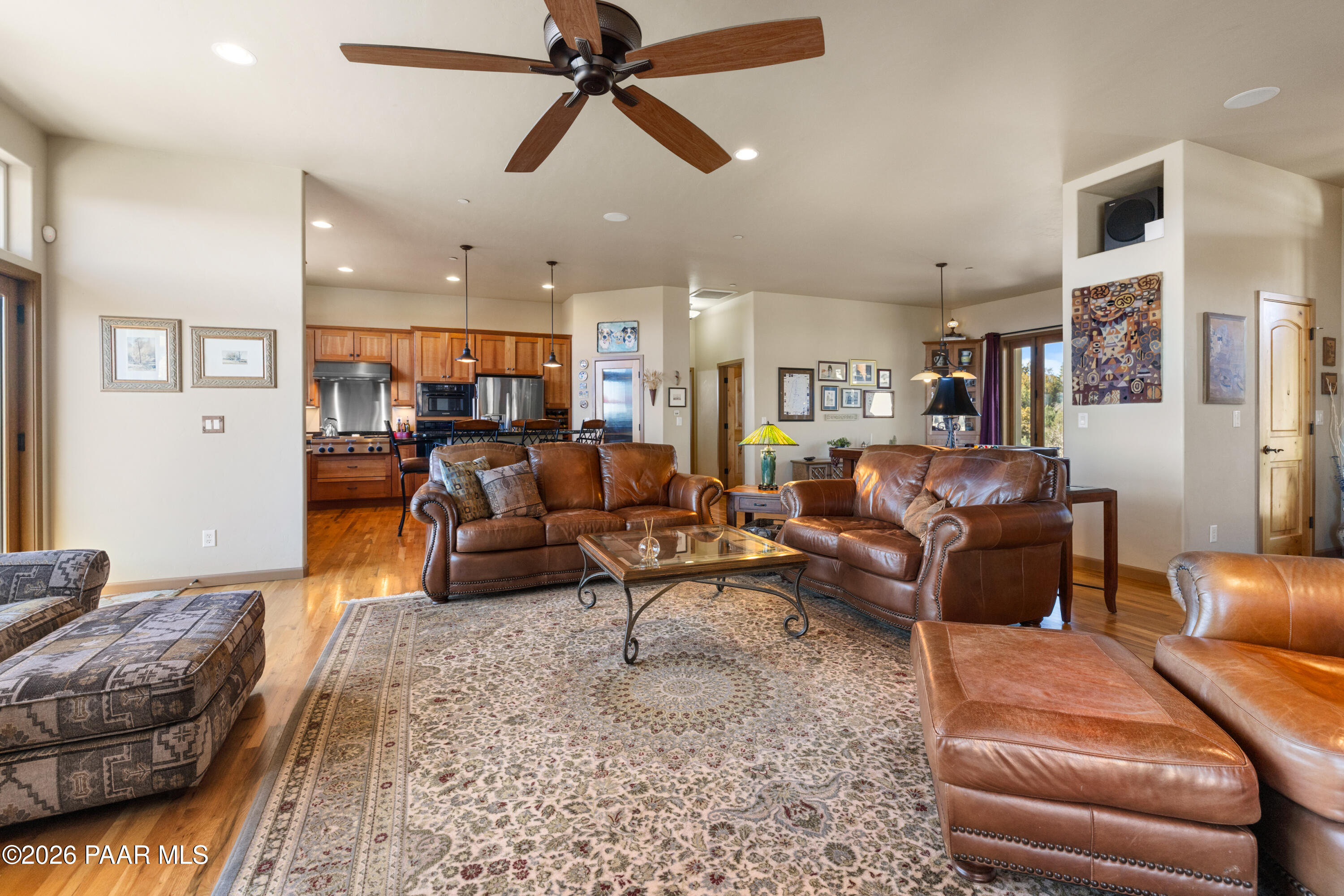 1448 Short Point Lane Prescott, AZ 86305 - Photo 18 of 56 a living room with furniture kitchen view and a chandelier
