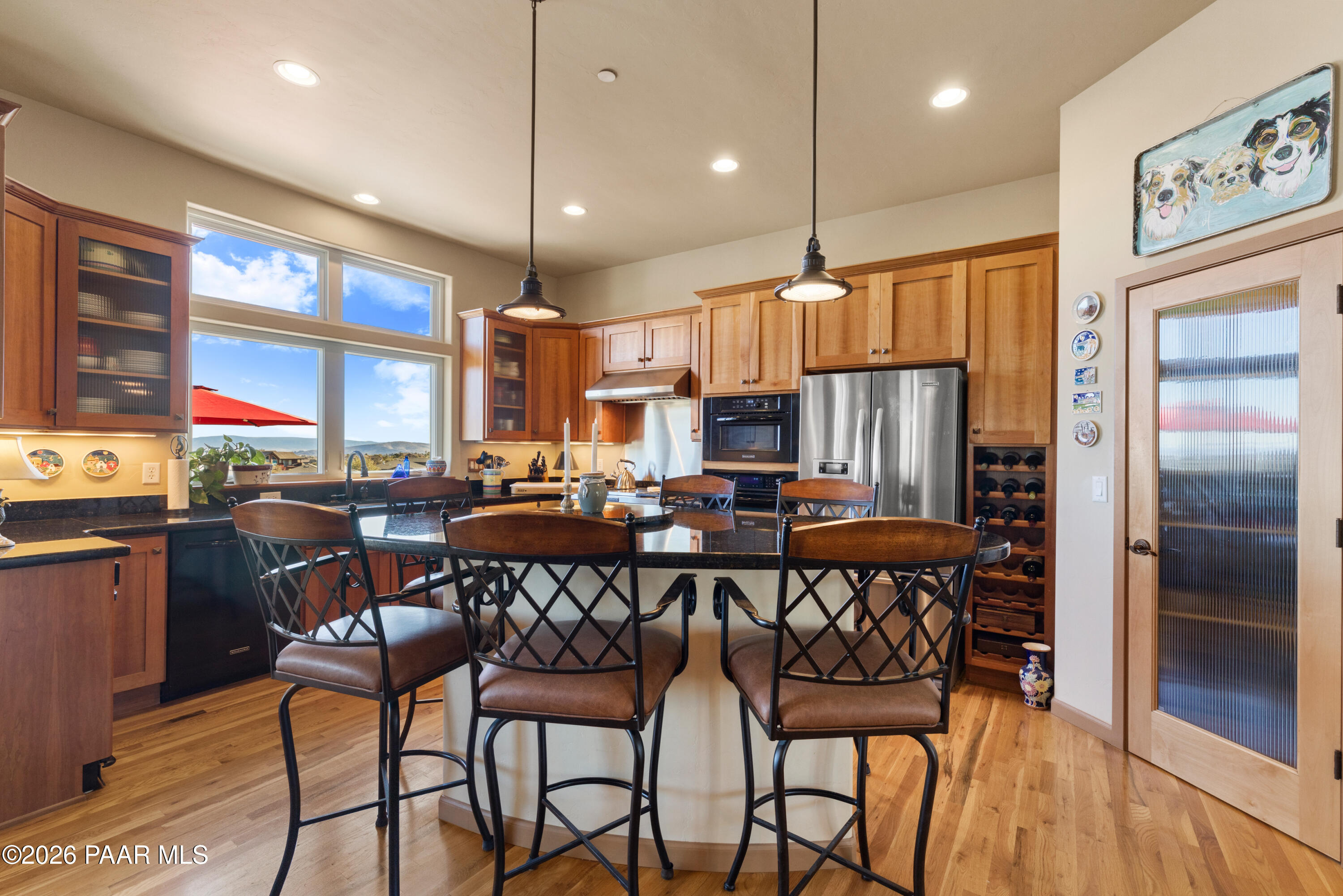 1448 Short Point Lane Prescott, AZ 86305 - Photo 19 of 56 a view of a dining room with furniture window and wooden floor