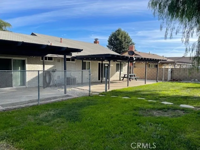 a view of a backyard with a patio