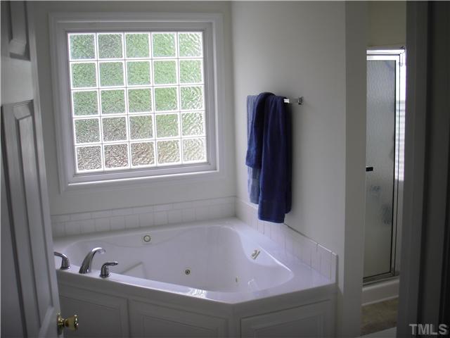 190 Punch Hill Farm Road Rougemont, NC 27572 - Photo 14 of 20 a bathroom with a tub and shower