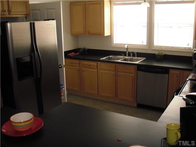 190 Punch Hill Farm Road Rougemont, NC 27572 - Photo 6 of 20 a kitchen with a sink and a refrigerator