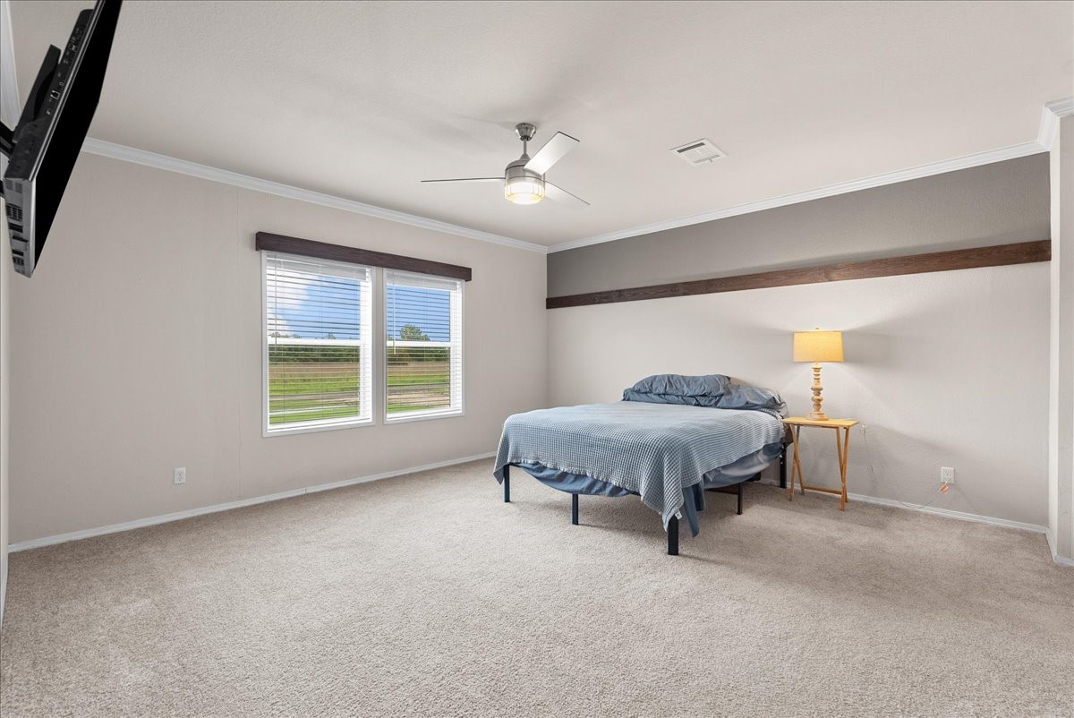 8710 Fm 646 Road South Santa Fe, TX 77510 - Photo 10 of 32 Spacious primary bedroom with ample natural light