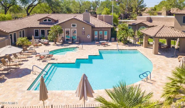a view of a house with outdoor space and sitting area