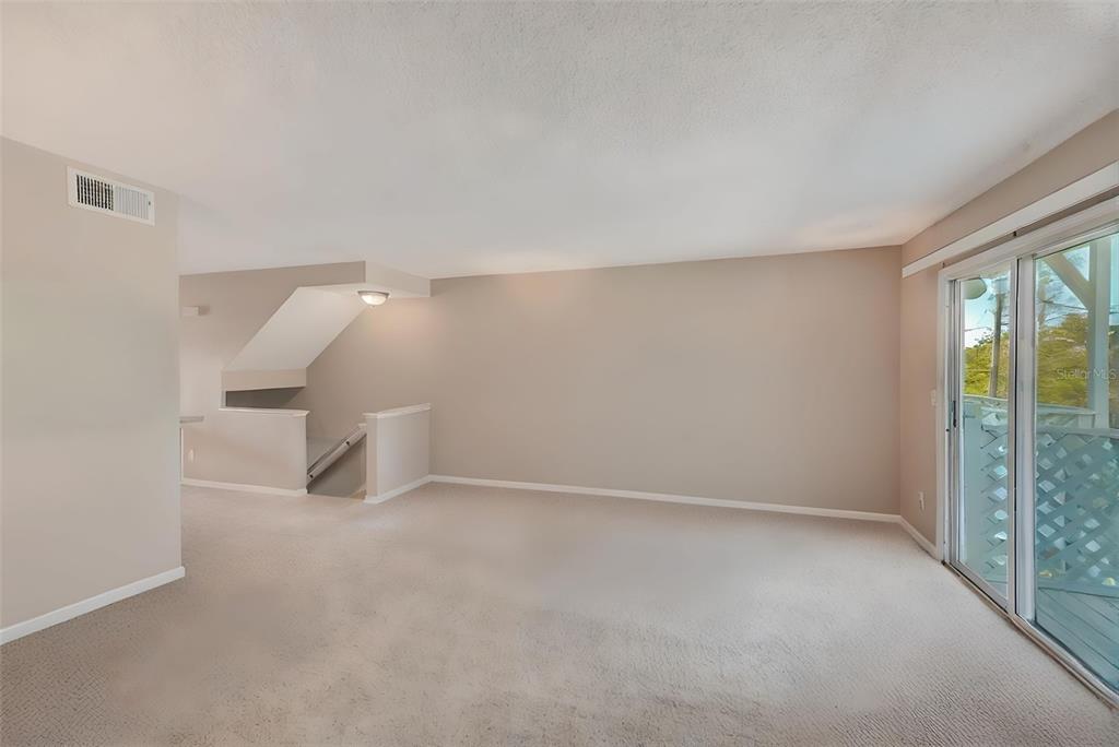 615 Garland Circle Indian Rocks Beach, FL 33785 - Photo 12 of 52 a view of an empty room with a window