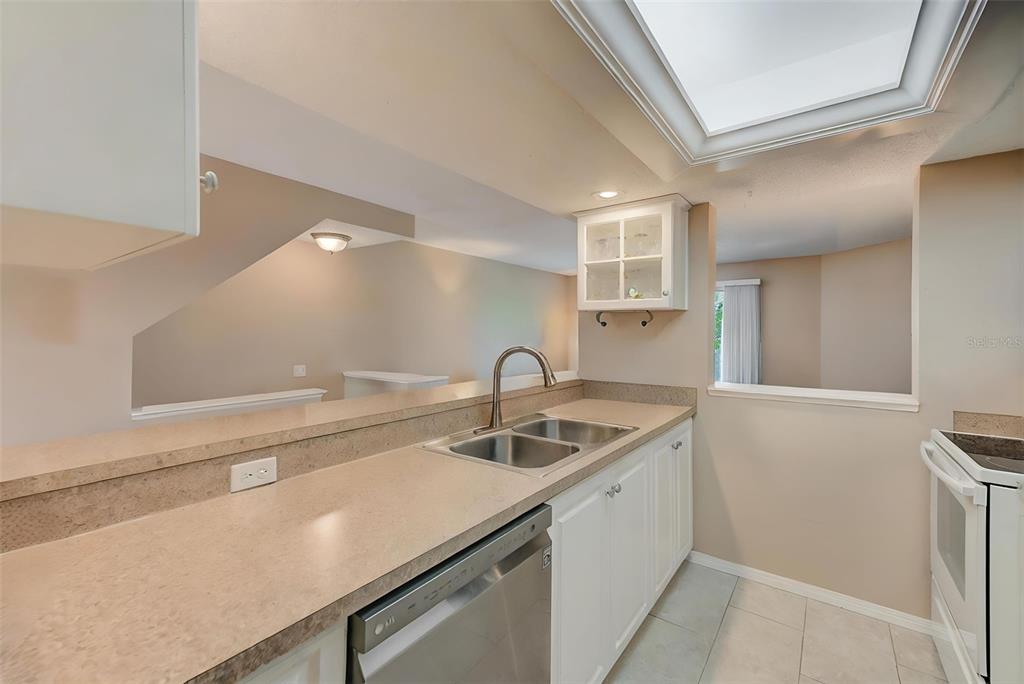 615 Garland Circle Indian Rocks Beach, FL 33785 - Photo 17 of 52 a kitchen with a sink and cabinets