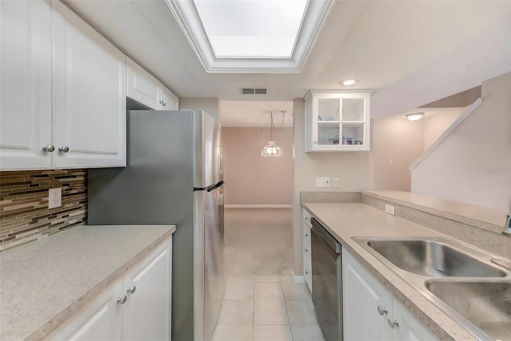 615 Garland Circle Indian Rocks Beach, FL 33785 - Photo 19 of 52 a kitchen that has a sink and a stove in it