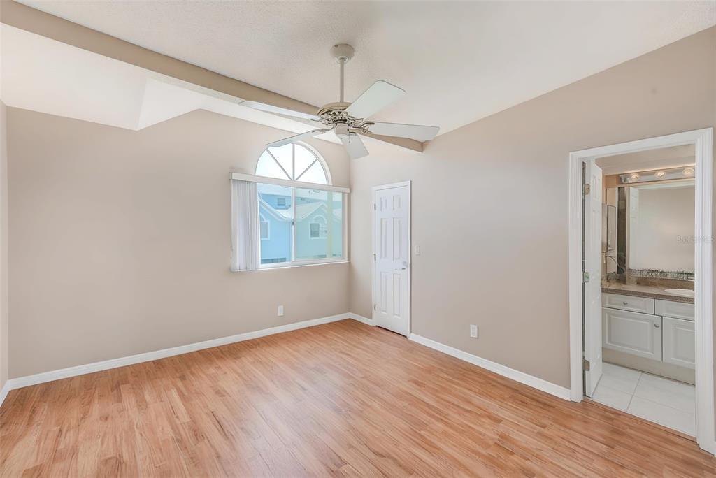615 Garland Circle Indian Rocks Beach, FL 33785 - Photo 23 of 52 wooden floor in an empty room with a window