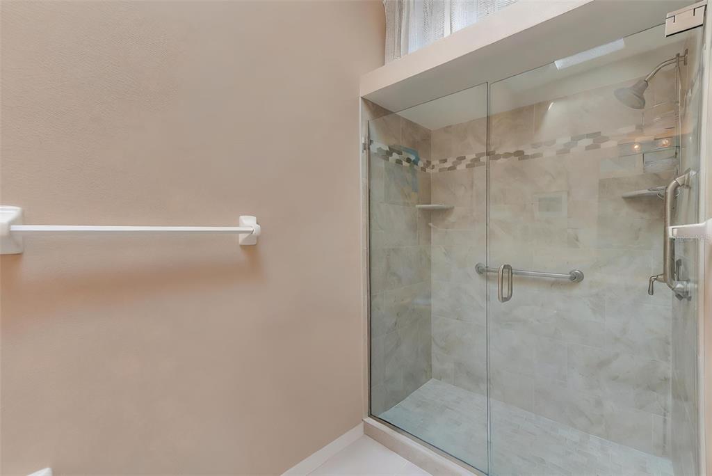 615 Garland Circle Indian Rocks Beach, FL 33785 - Photo 28 of 52 a bathroom with a shower