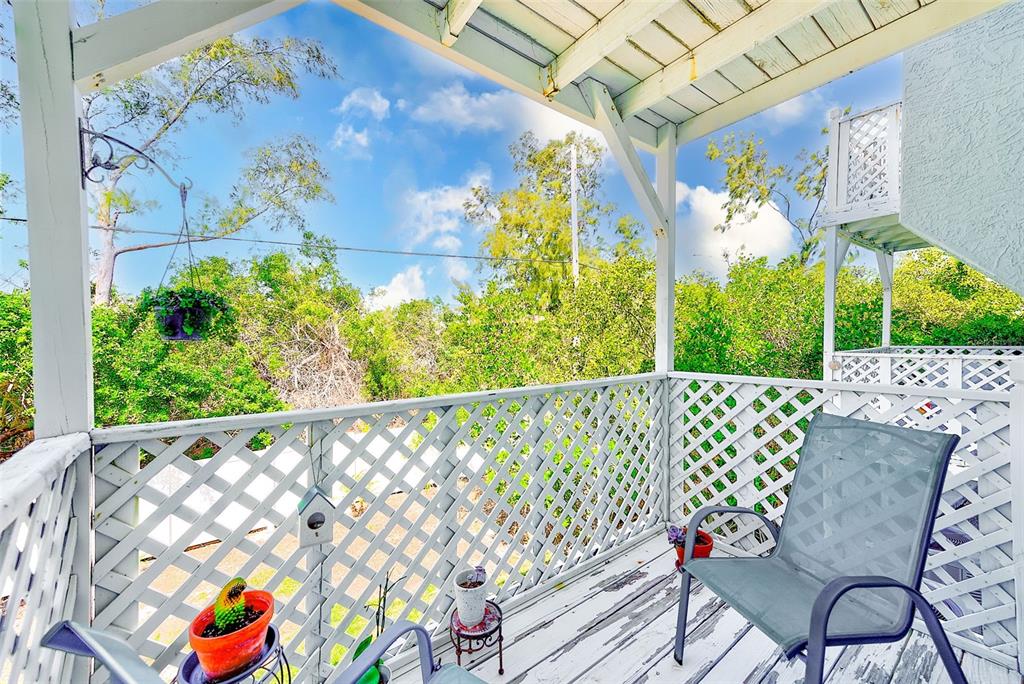 615 Garland Circle Indian Rocks Beach, FL 33785 - Photo 37 of 52 a view of a chairs and table in patio