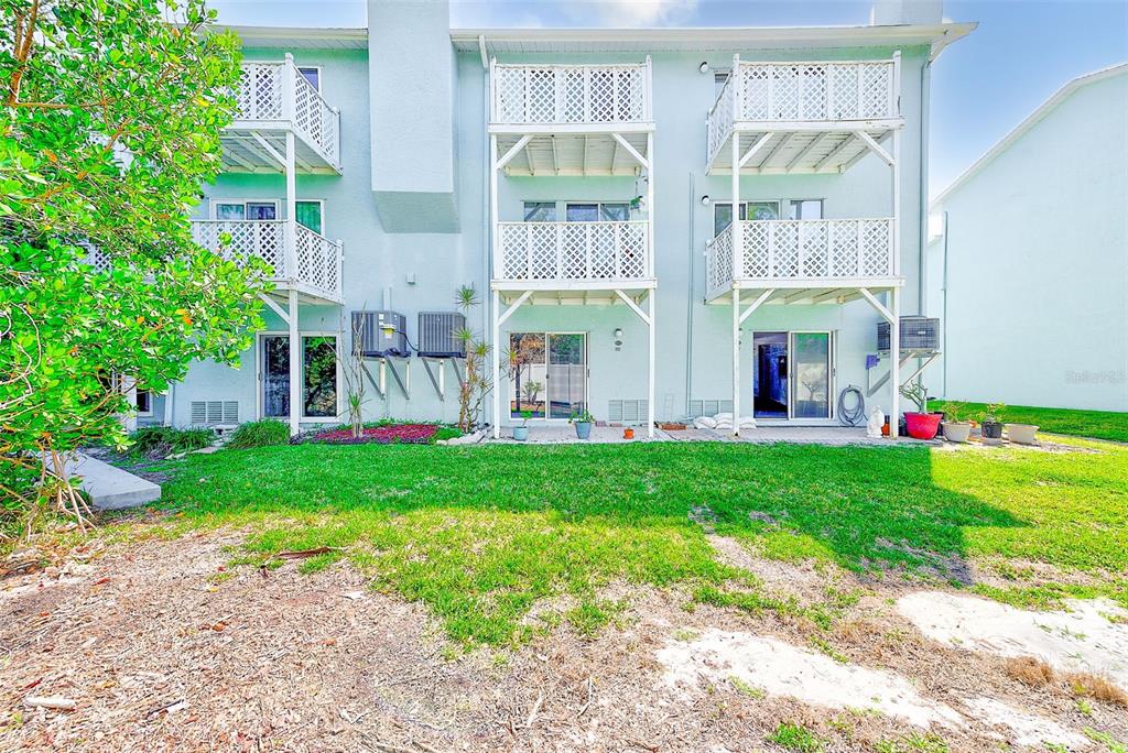 615 Garland Circle Indian Rocks Beach, FL 33785 - Photo 38 of 52 a view of an apartment with a garden and plants