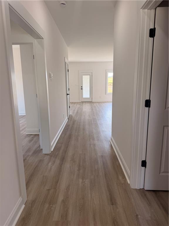 7213 King Road Valley, AL 36854 - Photo 3 of 20 Wood-finish flooring throughout, white walls, white trim, and a glass-paneled exterior door
