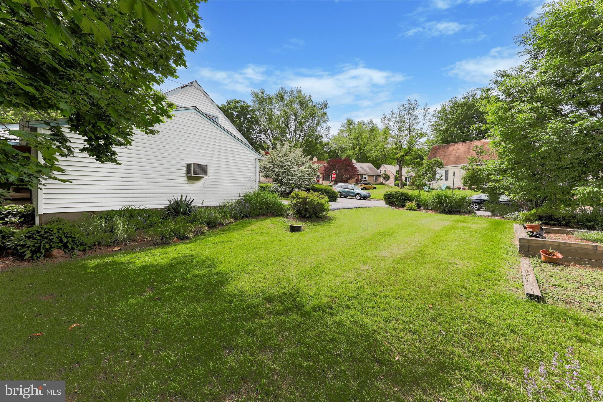 2305 Triebel Road Abington, PA 19001 - Photo 17 of 19 a backyard of a house with plants and large trees