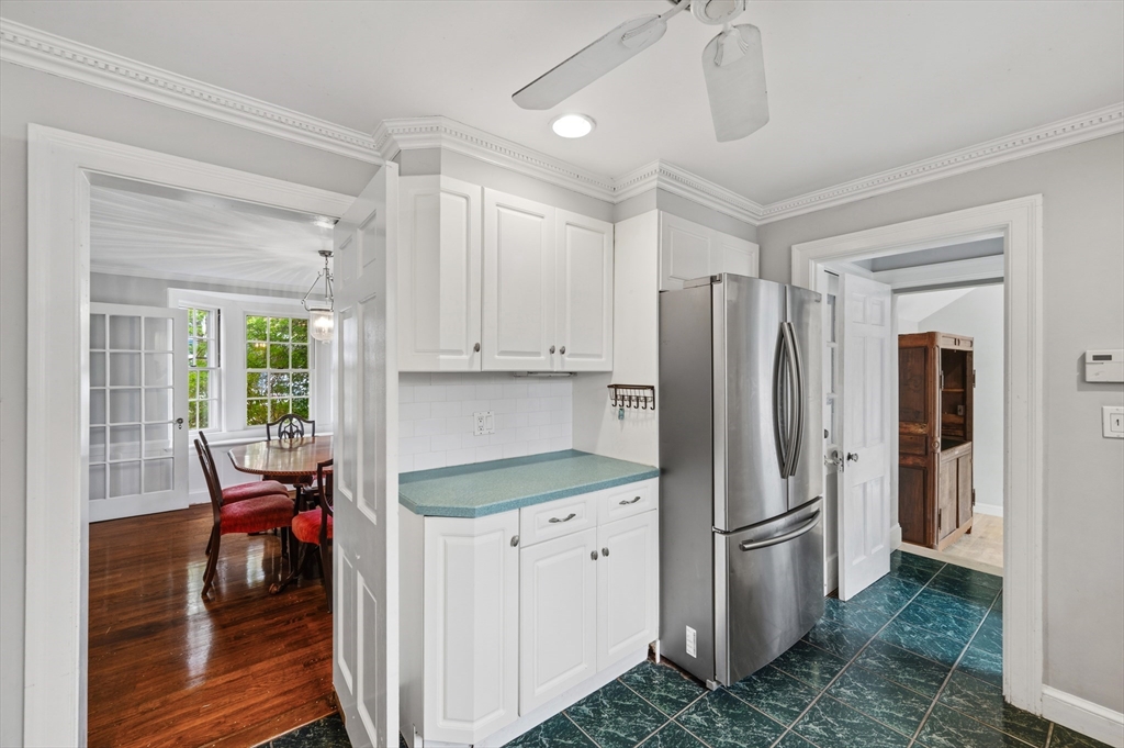 26 Pickwick Road Marblehead, MA 01945 - Photo 14 of 40 a kitchen with stainless steel appliances a refrigerator sink and cabinets