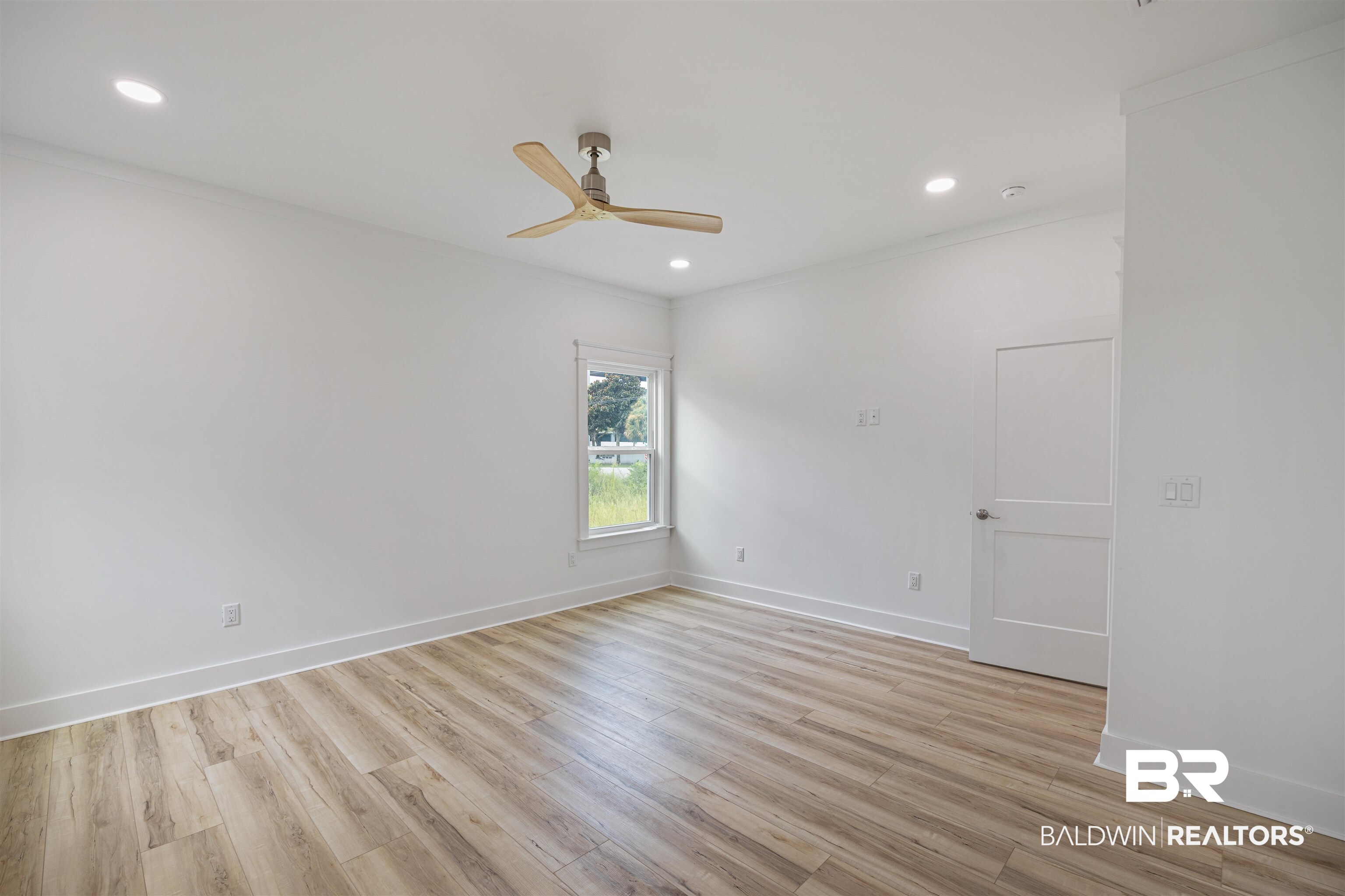 27591 Canal Road Orange Beach, AL 36561 - Photo 21 of 51 Spare room with crown molding, light wood-style flooring, recessed lighting, and a ceiling fan