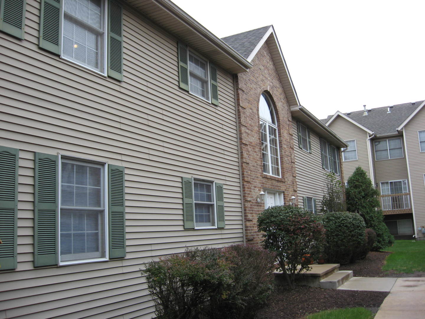 446 South Peace Road Sycamore, IL 60178 - Photo 1 of 12 a front view of a house with garden