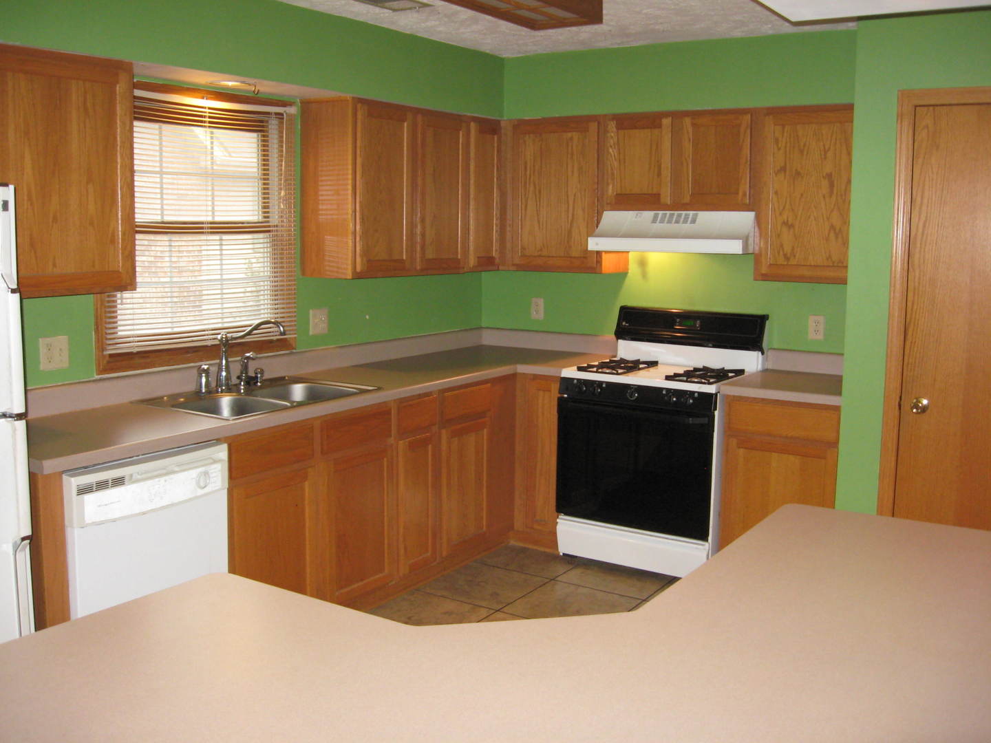 446 South Peace Road Sycamore, IL 60178 - Photo 4 of 12 a kitchen with stainless steel appliances granite countertop a sink stove and refrigerator