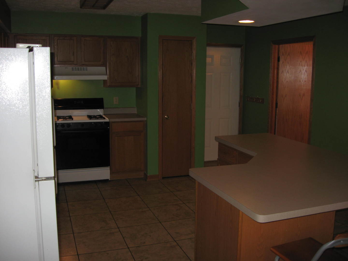 446 South Peace Road Sycamore, IL 60178 - Photo 5 of 12 a kitchen with a refrigerator and a stove