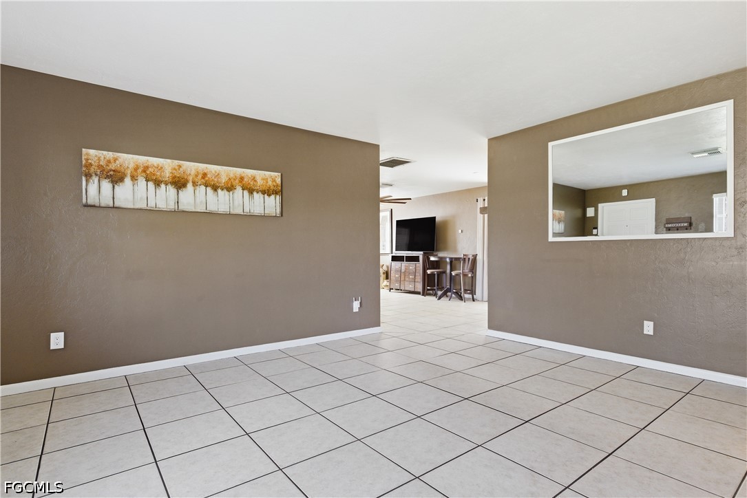 4960 20th Place Southwest Naples, FL 34116 - Photo 4 of 33 a view of a kitchen with furniture and an empty room
