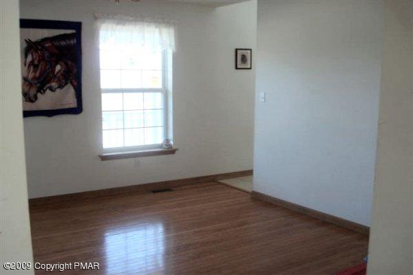 2 Old Stagecoach Road Kunkletown, PA 18058 - Photo 8 of 25 an empty room with wooden floor and window