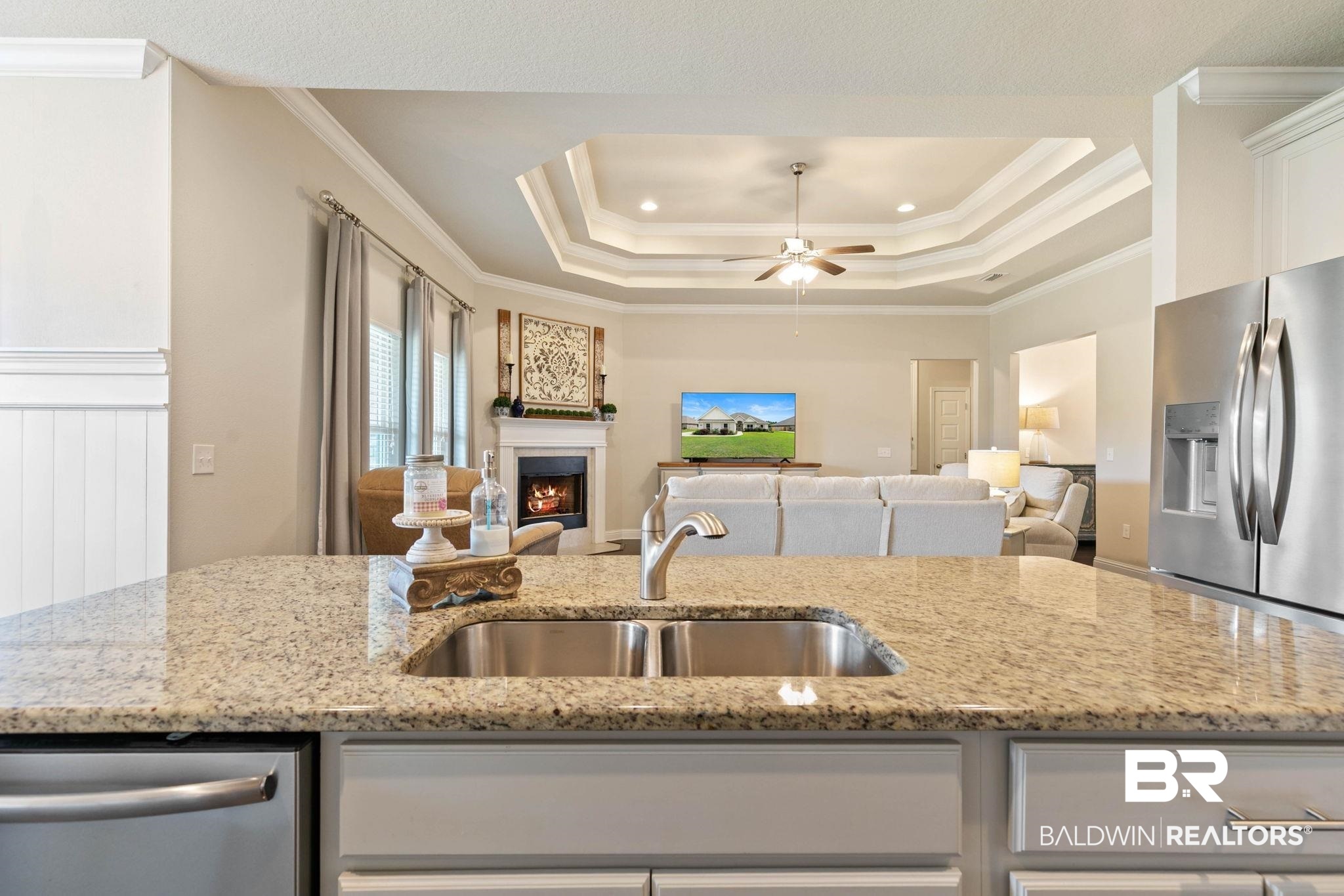 31187 Spoonbill Road Daphne, AL 36527 - Photo 16 of 85 Kitchen island with a double basin stainless steel sink and granite countertop