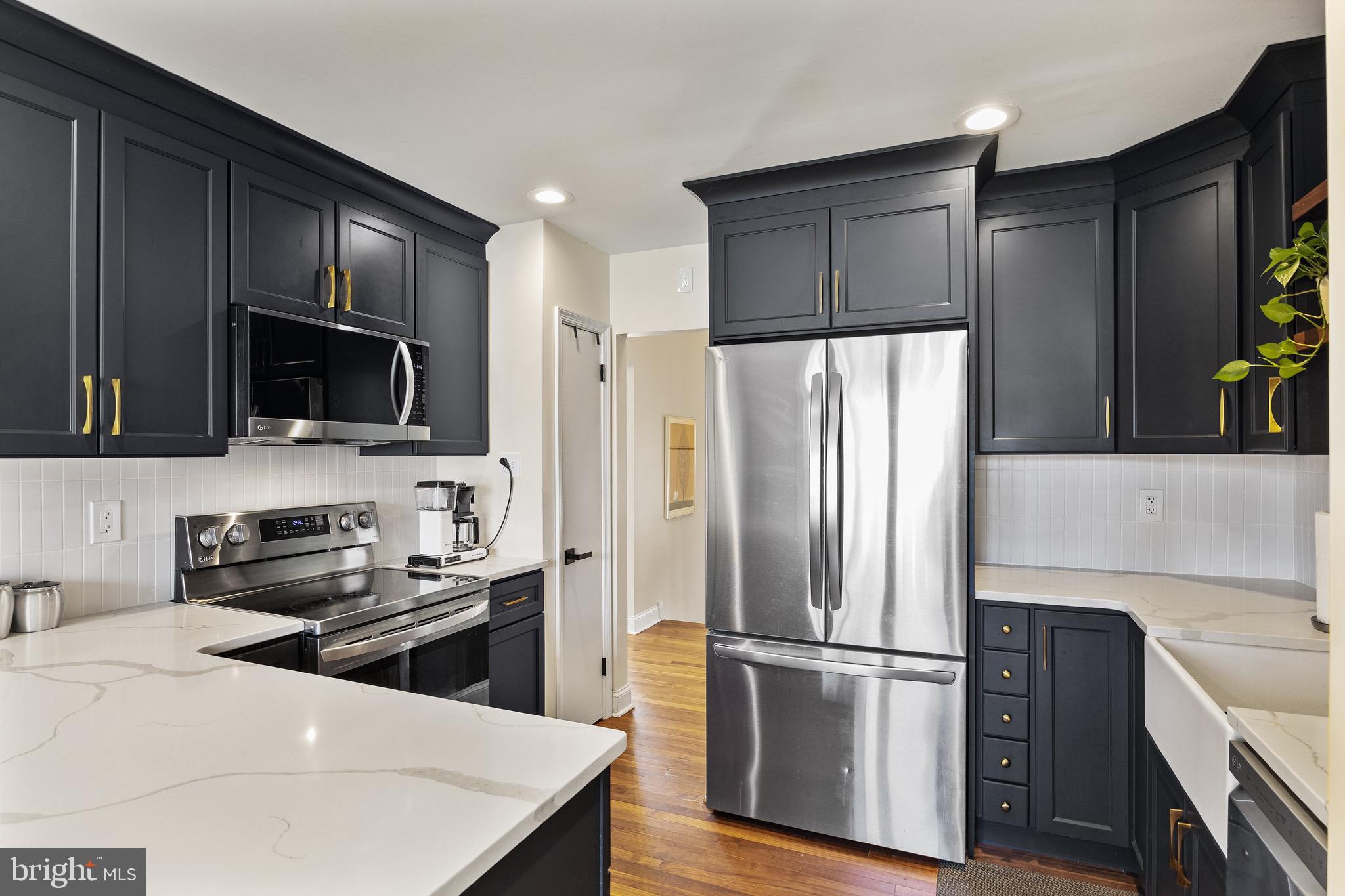 169 Canterbury Road Mount Laurel, NJ 08054 - Photo 12 of 47 a kitchen with a refrigerator stove and microwave
